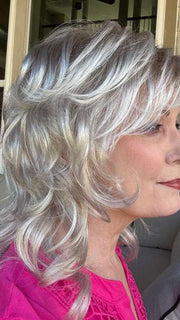 Mel B. @mels.be.ageless wearing TRESS by RAQUEL WELCH WIGS in color R23S GLAZED VANILLA | Cool Platinum Blonde with Almost White Highlights
