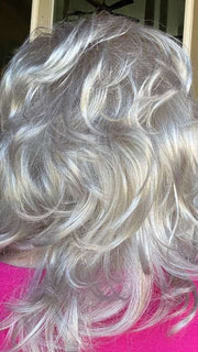Mel B. @mels.be.ageless wearing TRESS by RAQUEL WELCH WIGS in color R23S GLAZED VANILLA | Cool Platinum Blonde with Almost White Highlights
