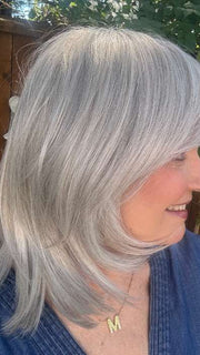 Mel B. @mels.be.ageless wearing TEXTURED LAYERS by HAIRDO in color R56/60 SILVER MIST | Lightest Gray Evenly Blended with Pure White
