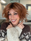 ROXIE wearing JOSS by RENE OF PARIS in SHADED-AMBER | Coppery Blonde and Red Blend with Dark Amber Brown Roots