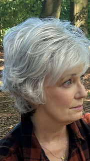 Mel B. @mels.be.ageless wearing VOLTAGE LARGE by RAQUEL WELCH WIGS in color RL51/61 ICED GRANITA | Lightest Grey Progresses to a Deep Grey at the Nape