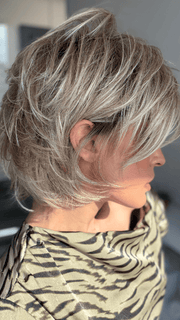 Model is wearing SKY in EXCLUSIVE COLOR ARABIAN SAND™ | Neutral Chocolate Brown Roots fade into a Neutral Blonde Base, blended with Sandy, Chestnut, Golden, and Honey Blondes, with Soft Creamy Blonde Highlights and Face-Framing Lowlights