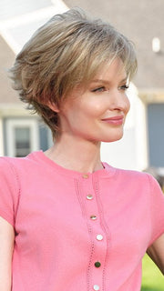 Model wearing MICKI by ENVY in SAHARA-BLONDE | Softer Dark Blonde with Light Golden Blonde, and features Chestnut Roots