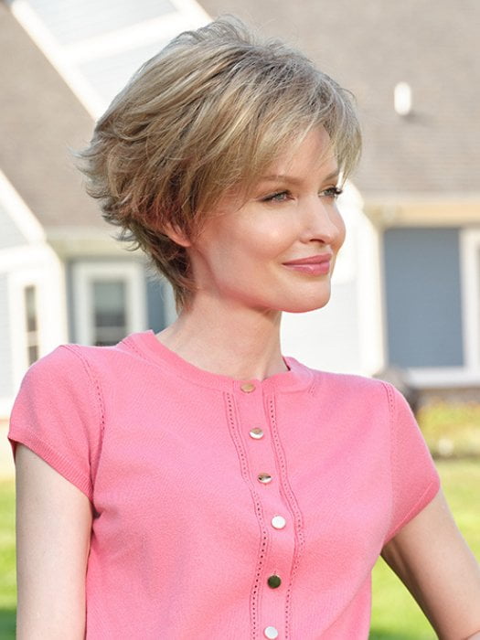 Model wearing MICKI by ENVY in SAHARA-BLONDE | Softer Dark Blonde with Light Golden Blonde, and features Chestnut Roots
