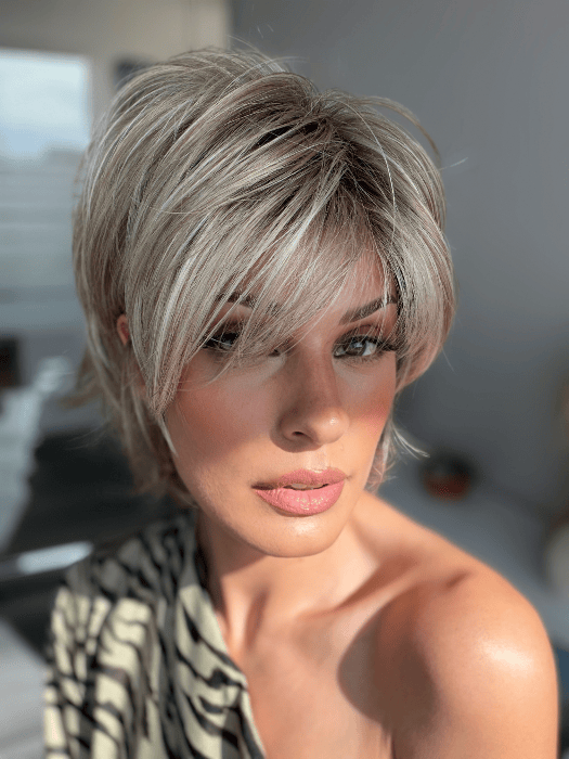 Model is wearing SKY in EXCLUSIVE COLOR ARABIAN SAND™ | Neutral Chocolate Brown Roots fade into a Neutral Blonde Base, blended with Sandy, Chestnut, Golden, and Honey Blondes, with Soft Creamy Blonde Highlights and Face-Framing Lowlights. 