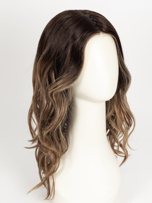 RL4/15OM | Dark brown blended roots that transition into a natural blonde ombré from midlength to the ends