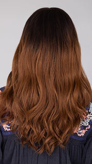 Roxie wearing BALAYAGE BEAUTY by RAQUEL WELCH in RL2/31OM | Black blend from the roots to midlength that transition into a medium light auburn ombré from midlength to the ends