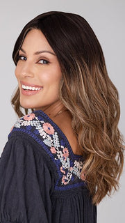 Roxie wearing BALAYAGE BEAUTY by RAQUEL WELCH in RL4/15OM | Dark brown blended roots that transition into a natural blonde ombré from midlength to the ends