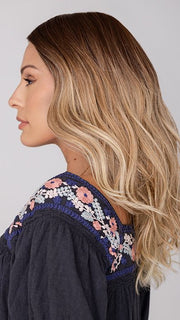 Roxie wearing BALAYAGE BEAUTY by RAQUEL WELCH in RL8/24OM | Medium brown blended roots that transition into a golden blonde ombré from midlength to the ends