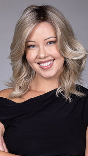 Model is wearing ANNA by BELLETRESS in color BUTTERBEER R | Dark Brown Base and Root that transitions smoothly into a buttery blonde, infused with creamy honey and toffee tones