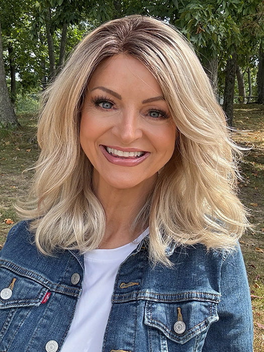 Sandy @i_be_wiggin wearing AMANDA by ENVY in color SILKY BEIGE | Light Platinum Blonde with Dark Brown Roots