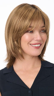 Model is wearing AMBER by ENVY in color TOASTED SESAME | Medium Brown roots with overall Warm Cinnamon base and Wheat Blonde highlights