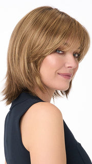 Model is wearing AMBER by ENVY in color TOASTED SESAME | Medium Brown roots with overall Warm Cinnamon base and Wheat Blonde highlights
