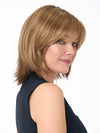 Model is wearing AMBER by ENVY in color TOASTED SESAME | Medium Brown roots with overall Warm Cinnamon base and Wheat Blonde highlights