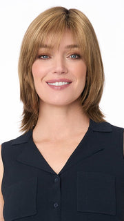 Model is wearing AMBER by ENVY in color TOASTED SESAME | Medium Brown roots with overall Warm Cinnamon base and Wheat Blonde highlights