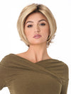Model is wearing ANGIE by ENVY in color SPARKLING-CHAMPAGNE | Medium Brown roots with overall Strawberry Blonde base and soft Golden Blonde highlights