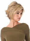 Model is wearing ANGIE by ENVY in color SPARKLING-CHAMPAGNE | Medium Brown roots with overall Strawberry Blonde base and soft Golden Blonde highlights