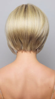 Model is wearing AYUMI by NORIKO in color Light Ash Blond R | Cream Ash Blonde with ash brown and white-grey roots that blend into a variety of ash blonde tones, including ash pearl blonde, creamy ivory, and pale cream