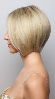 Model is wearing AYUMI by NORIKO in color Light Ash Blond R | Cream Ash Blonde with ash brown and white-grey roots that blend into a variety of ash blonde tones, including ash pearl blonde, creamy ivory, and pale cream