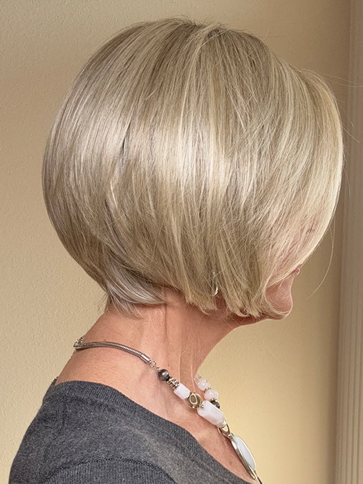 Eileen @crazywiglady is wearing AYUMI by NORIKO in color NM LIGHT ASH BLOND-R | This stunning cream ash blonde features natural-looking ash brown and white-grey roots that blend seamlessly into a variety of ash blonde tones. Woven with ash pearl blonde, creamy ivory, and pale creams, this fashion-forward shade delivers a sophisticated, multi-tonal finish for an elegant ash blonde look.