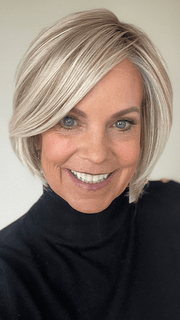 Susan Sparks @sparkles_intheworld wearing STRAIGHT UP WITH A TWIST by RAQUEL WELCH WIGS in color SS19/23 SHADED BISCUIT | Cool Platinum blonde with subtle highlights and medium brown roots