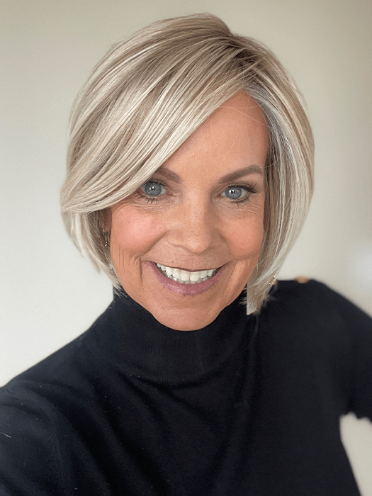 Susan Sparks @sparkles_intheworld wearing STRAIGHT UP WITH A TWIST by RAQUEL WELCH WIGS in color RL19/23SS SHADED BISCUIT | Cool Platinum blonde with subtle highlights and medium brown roots