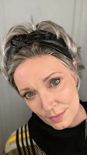 Mel B. @mels.be.ageless wearing RAISE by ELLEN WILLE in color STONEGREY-ROOTED 56.60.48 | Blend of Medium Brown Silver Grey and white with Dark Roots