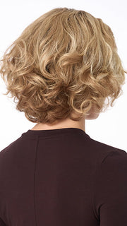 Model is wearing BIANCA by ENVY in color SPARKLING-CHAMPAGNE | Medium Brown roots with overall Strawberry Blonde base and soft Golden Blonde highlights