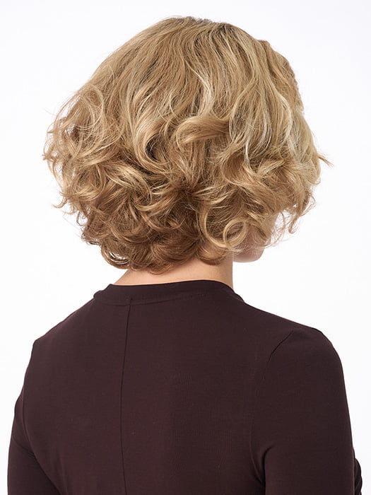 Model is wearing BIANCA by ENVY in color SPARKLING-CHAMPAGNE | Medium Brown roots with overall Strawberry Blonde base and soft Golden Blonde highlights