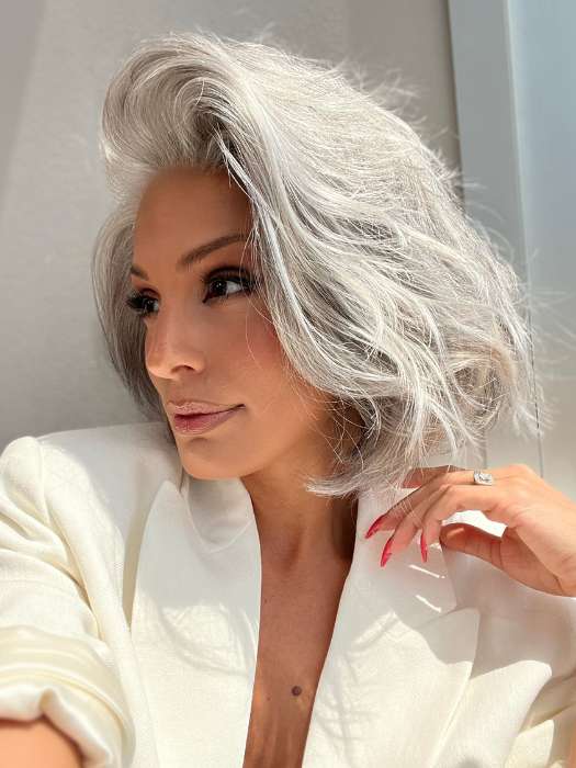 Model is wearing SAGE by ESTETICA in color R51LF60 | Off Black with 75% Grey Lightening to Gold Blonde Mix in Front