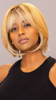 Model is wearing ARIA by RENE OF PARIS in shade PEACHES-AND-CREAM | A vibrant peach blonde with creamy undertones and bright, face-framing cream highlights. Rich chocolate root adds depth.