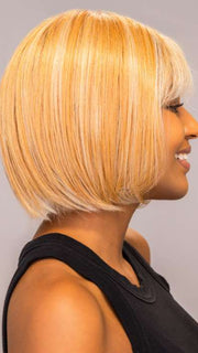 Model is wearing ARIA by RENE OF PARIS in shade PEACHES-AND-CREAM | A vibrant peach blonde with creamy undertones and bright, face-framing cream highlights. Rich chocolate root adds depth.