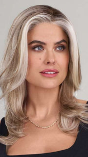 Model is wearing MIRANDA by JON RENAU in color 101/88/27S8 CATALINA BLONDE | Pale blonde with Pure White Natural Violet halo highlights, shaded medium brown