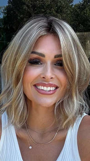 Crystal @crystallhoneycutt is wearing CHARLOTTE by ENVY  in SAHARA BLONDE | Softer Dark Blonde with Light Golden Blonde, and features Chestnut Roots