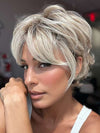 Model is wearing CURATED CUT by RAQUEL WELCH in color RL19/23SS SHADED BISCUIT | Light Ash Blonde Evenly Blended with Cool Platinum Blonde with Dark Roots