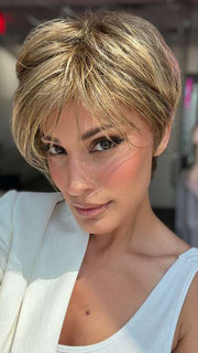 Model is wearing SHARI by ENVY in color 24/18 FROSTED | Light Brown with Wheat Blonde blended highlights