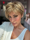 Model is wearing SHARI by ENVY in color 24/18 FROSTED | Light Brown with Wheat Blonde blended highlights