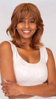 Model is wearing ON MY WAY by RAQUEL WELCH in color RL31/29 FIERY COPPER | Medium Light Auburn Evenly Blended with Ginger Blonde