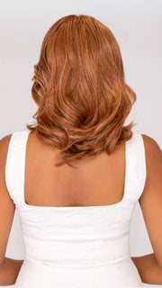 Model is wearing ON MY WAY by RAQUEL WELCH in color RL31/29 FIERY COPPER | Medium Light Auburn Evenly Blended with Ginger Blonde