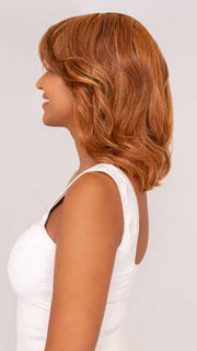 Model is wearing ON MY WAY by RAQUEL WELCH in color RL31/29 FIERY COPPER | Medium Light Auburn Evenly Blended with Ginger Blonde