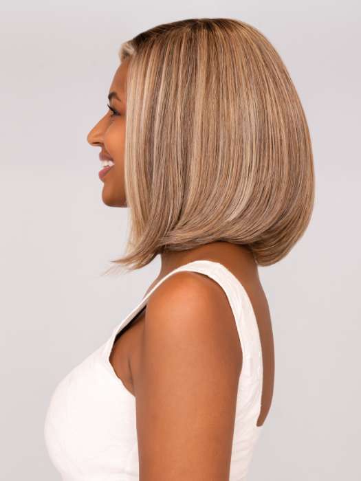Model is wearing ALWAYS TRENDING by RAQUEL WELCH in color SS12/22 SHADED CAPPUCCINO | Light Golden Brown Evenly Blended with Cool Platinum Blonde Highlights with Dark Roots