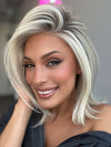 Model is wearing HAUTE by JON RENAU in color 101/88/27S8 CATALINA BLONDE | Pale blonde with Pure White Natural Violet halo highlights, shaded medium brown