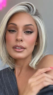 Model is wearing HAUTE by JON RENAU in color 101/88/27S8 CATALINA BLONDE | Pale blonde with Pure White Natural Violet halo highlights, shaded medium brown