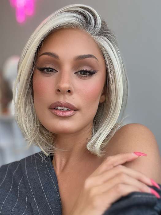 Model is wearing HAUTE by JON RENAU in color 101/88/27S8 CATALINA BLONDE | Pale blonde with Pure White Natural Violet halo highlights, shaded medium brown