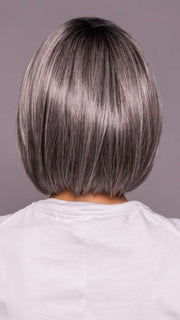 Model is wearing DUA by ELLEN WILLE in color DARK GREY FROSTED | A sophisticated, cool-toned grey with highlights that give your hair an icy, chic vibe.