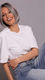 Model is wearing DUA by ELLEN WILLE in color DARK GREY FROSTED | A sophisticated, cool-toned grey with highlights that give your hair an icy, chic vibe.