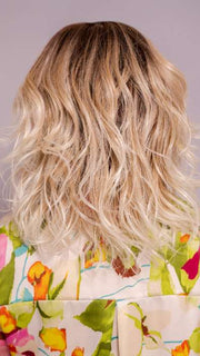 Model is wearing ROHAN by AMORE in color MELTED SAND | Rich, warm brown root melts into the neutral blond tone. Light-beige blond ends complete this stunning color.   