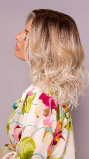 Model is wearing ROHAN by AMORE in color MELTED SAND | Rich, warm brown root melts into the neutral blond tone. Light-beige blond ends complete this stunning color.   