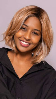 Model is wearing MIRA by AMORE in color CINNAMON FROST R | Warm, medium coppery-brown base with white-blond highlights. The medium brown root color adds a realistic vibe.   
