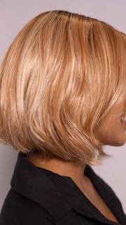 Model is wearing MIRA by AMORE in color CINNAMON FROST R | Warm, medium coppery-brown base with white-blond highlights. The medium brown root color adds a realistic vibe.   